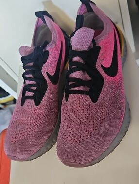 Nike Women’s Pink and Black Flyknit Running Sneakers
